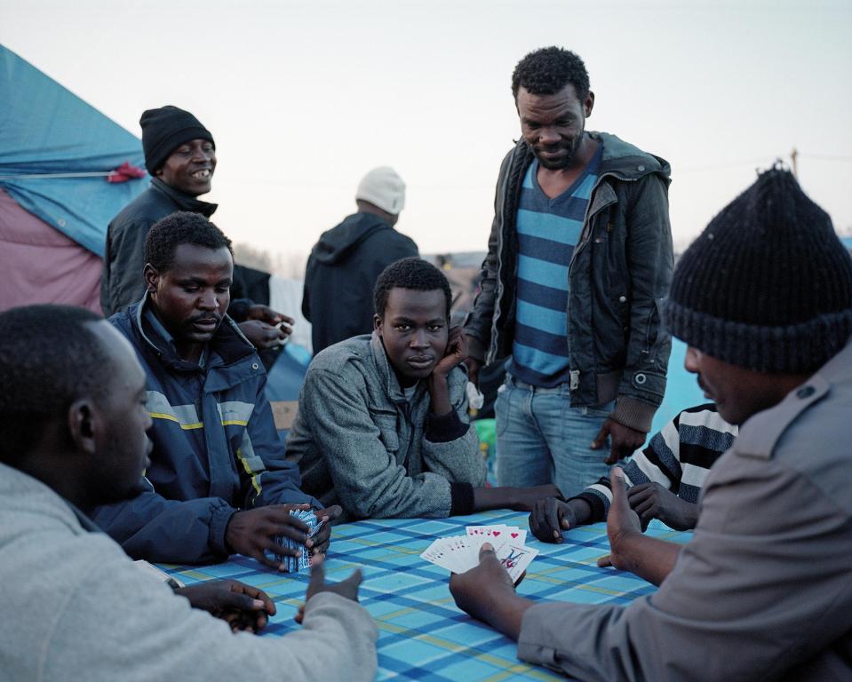  Daniel Castro Garcia's image taken in Calais, which shows Sudanese men playing cards