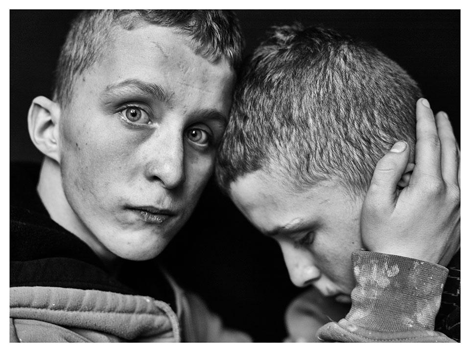  This emotive snap of two boys in a youth detention centre in Studzieniec, Poland, also features in the collection