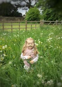  Helen Stone wanted a cute photo of her little girl running through the field but it resulted in a funny looking grassy moustache