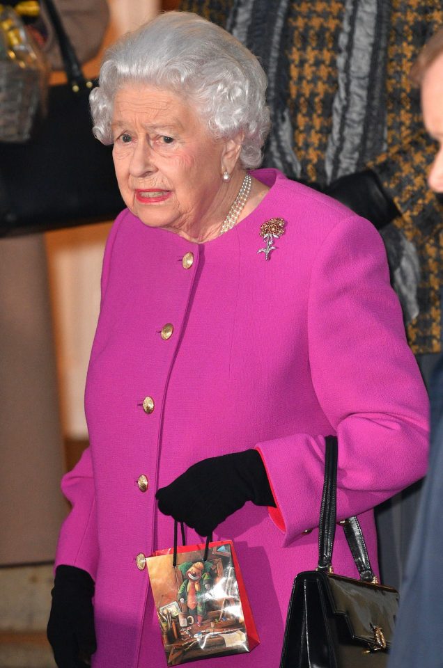  Gift . . . The Queen clutching onto a present yesterday