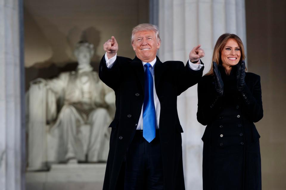  Big shoes to fill . . Trump and Melania with capital’s Lincoln Memorial in the background