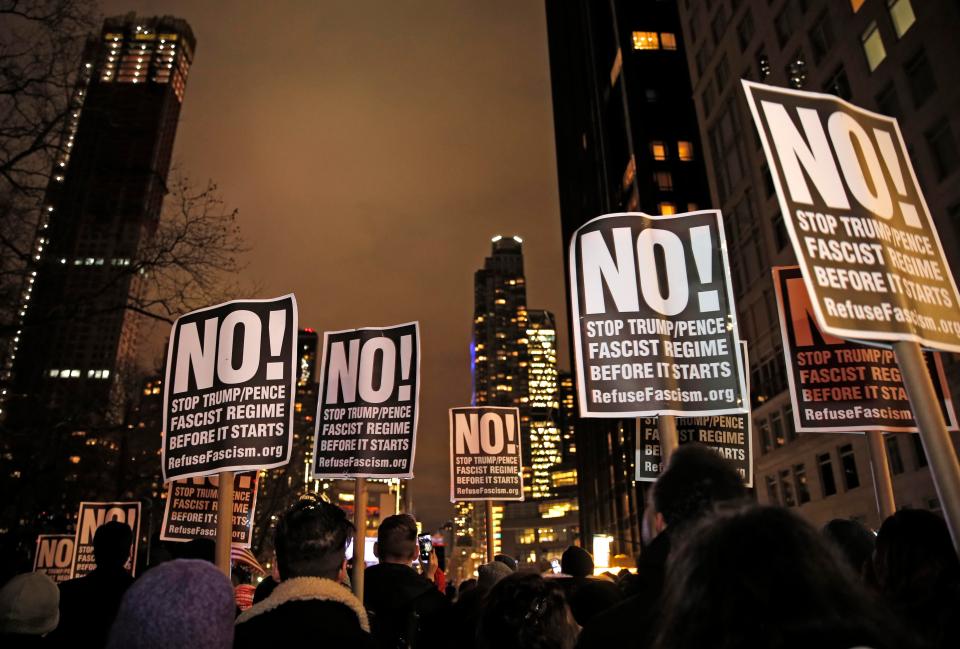  Thousands took the street armed with anti-Trump picket signs