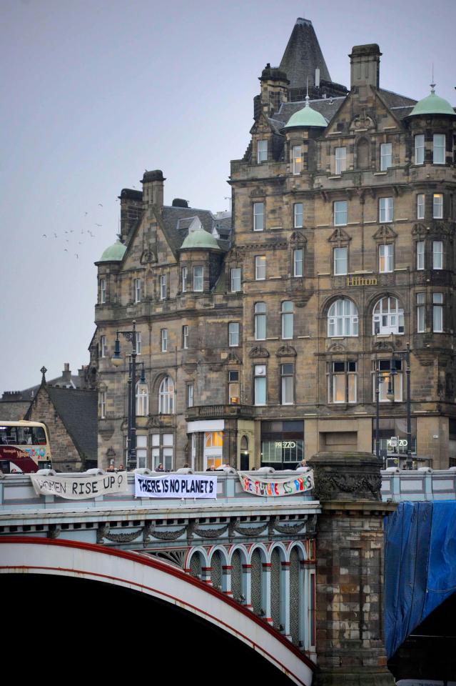  Banners hung from the North Bridge in Edinburgh as part of the Bridges Not Walls project