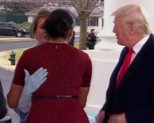  Melania quickly reciprocates the affection and hugs Michelle back