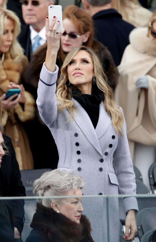  Lara Trump looked glamorous in a double-breasted lavender coat as she documented the action on her mobile