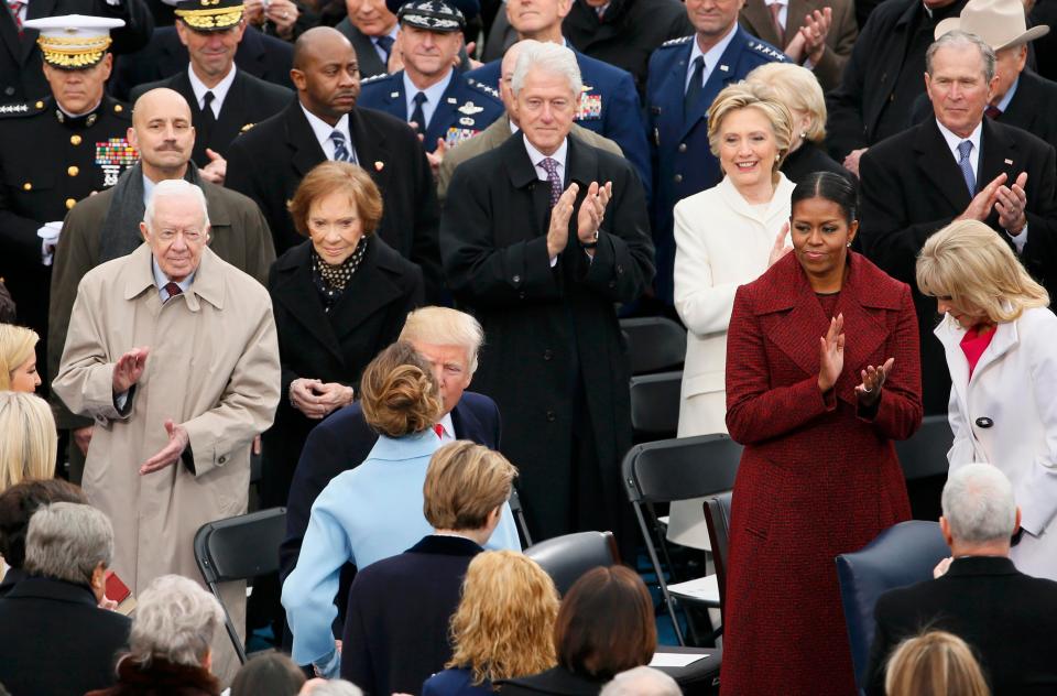  Trump kisses his wife Melania in front of former presidents Carter, Clinton, Bush and Obama