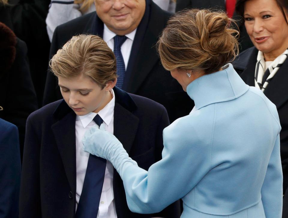  Melania was seen fixing Barron's tie during the ceremony