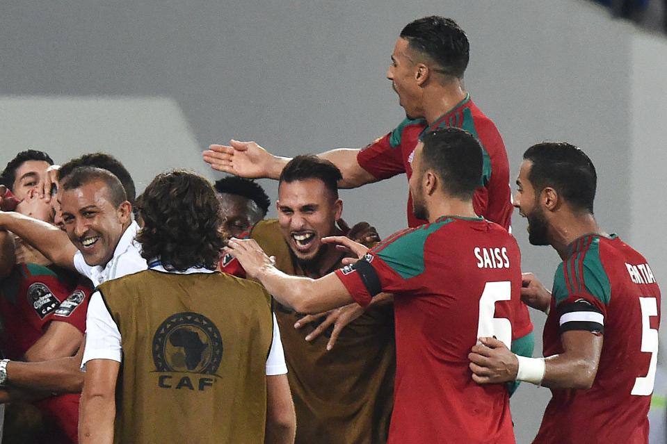  Morocco's players celebrate their third goal