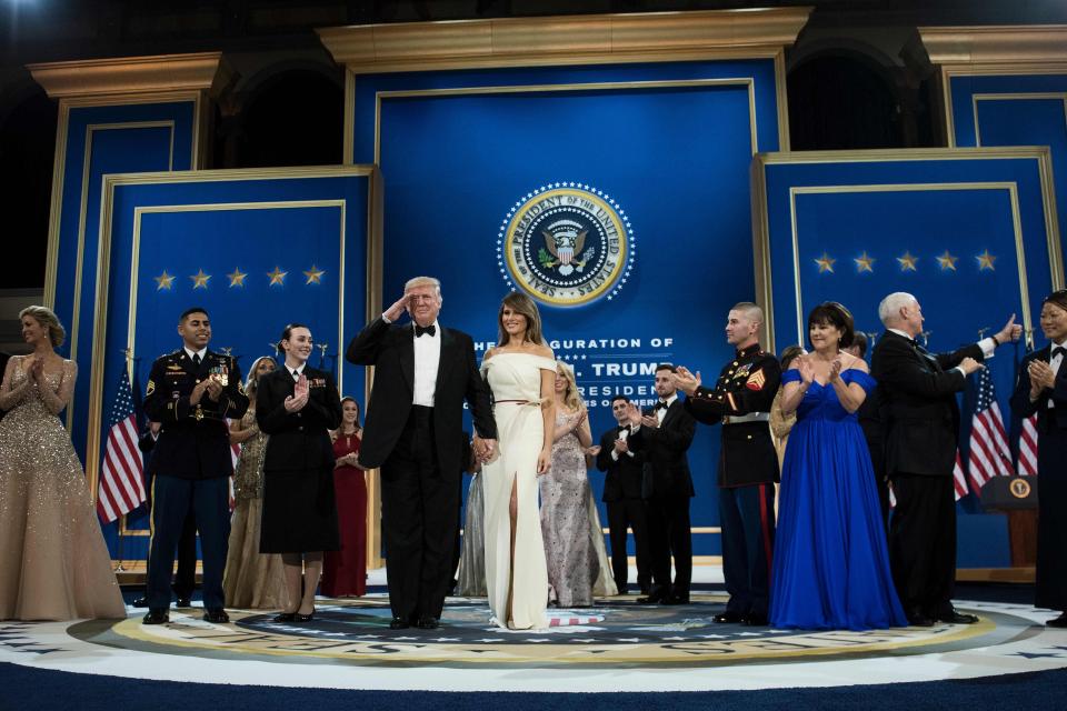  Trump salutes as he is joined on stages with Vice President Mike Pence and his wife Karen Pence