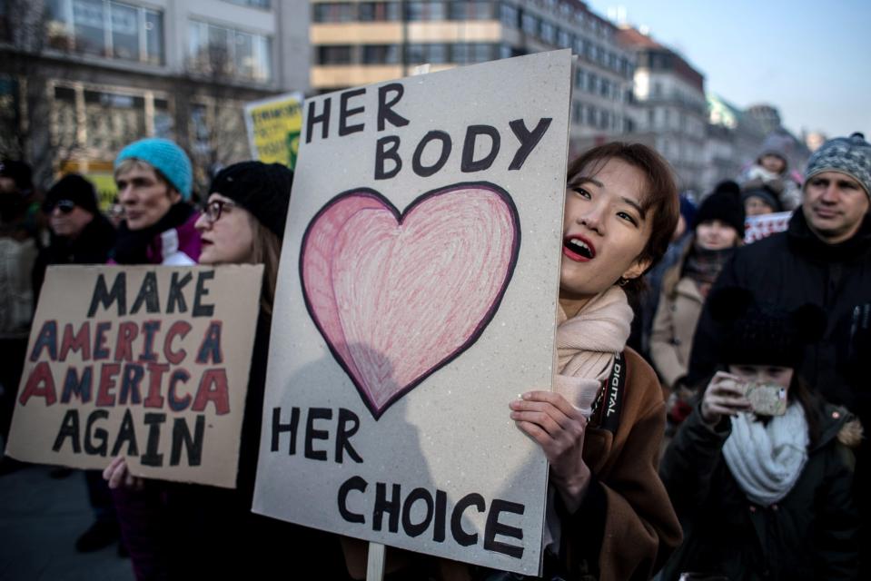  Protesters in Prague hold banners as they attend 'Love Trumps Hate' rally, an official sister protest to the Women's March in Washington