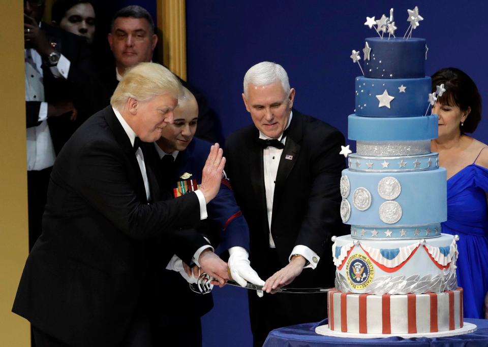  Trump was seen cutting his spectacular nine-tier cake at one of the inauguration balls