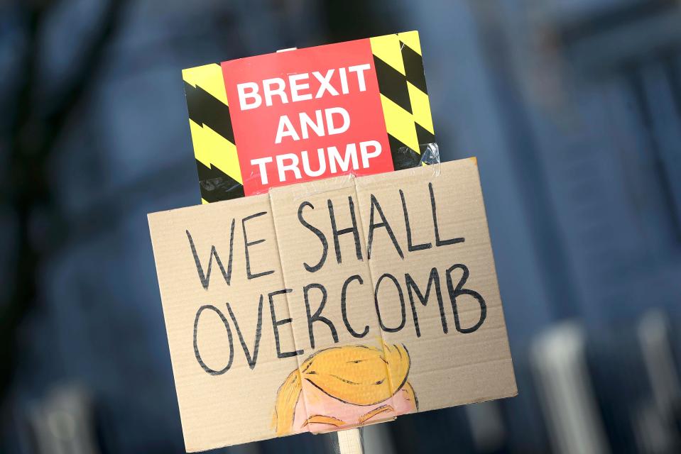  One sign held up by a protester on the campaign rally in London