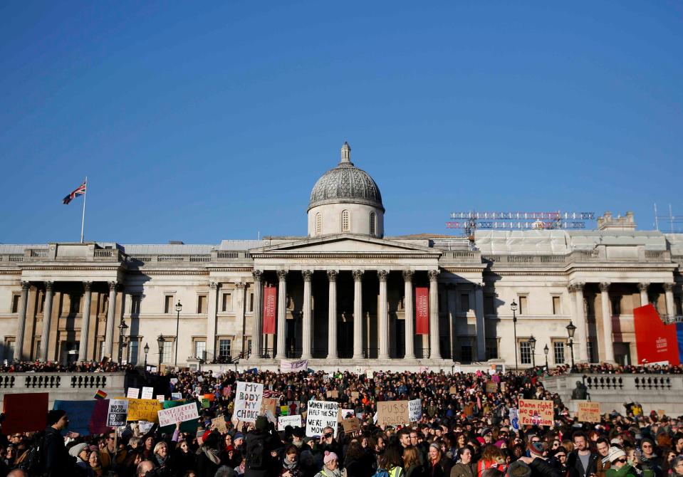  Crowds stand at Trafalgar Square after marching through Londo