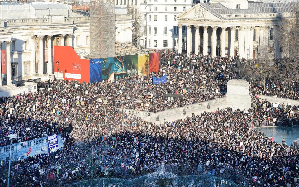  Protesters pictured listening to speeches in Trafalgar Square following the march