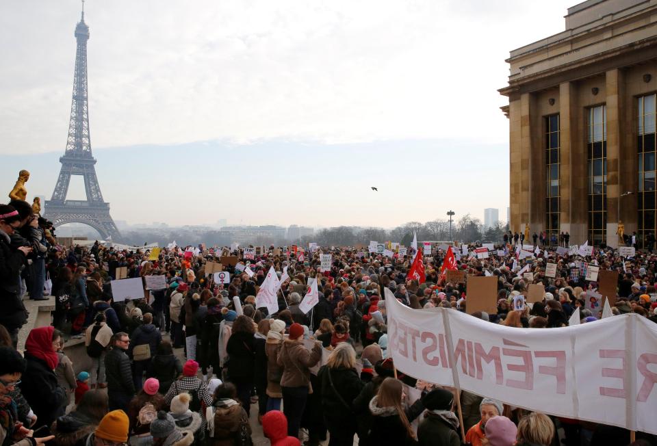  In Paris crowds stand in front of the Eiffel Tower