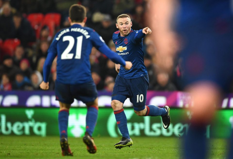 Rooney celebrates after breaking Sir Bobby Charlton's United record