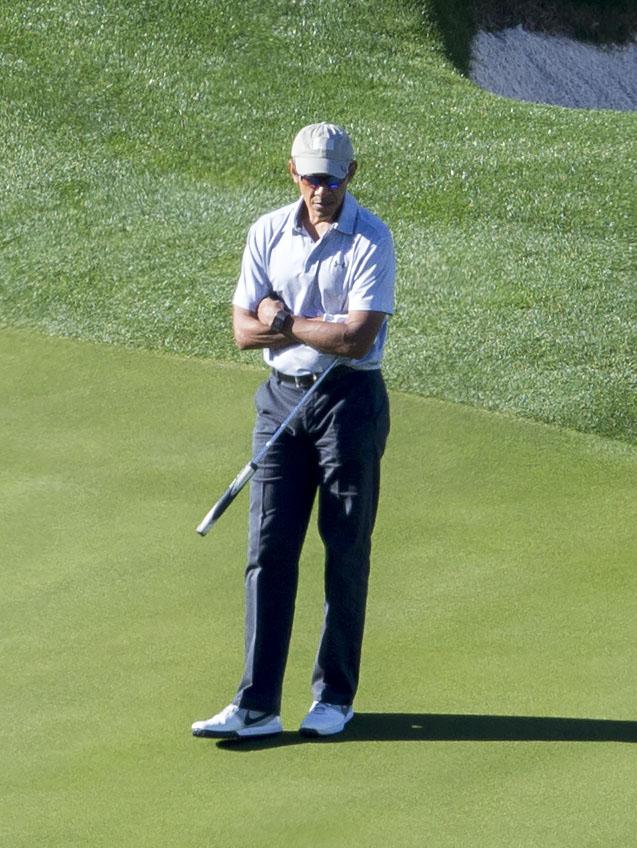  Former President Obama looked deep in thought as he played golf in California