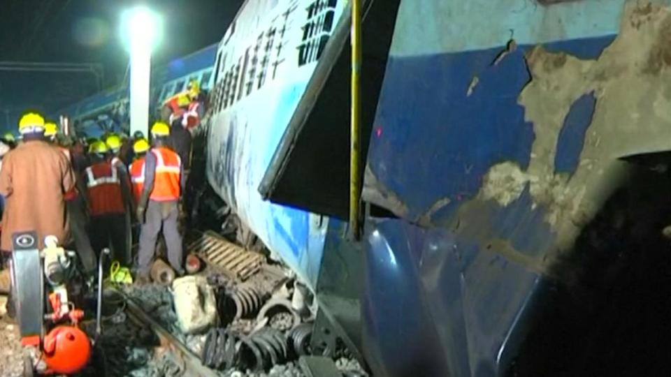  Workers dressed in high visibility vests and hard hats worked through the night