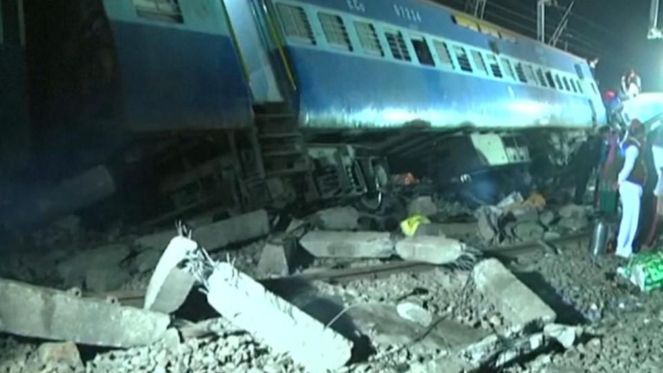  Footage from the scene shows a line of carriages on their side on top of mangled heaps of wreckage