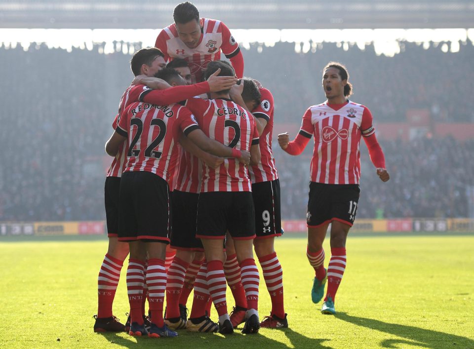  Ward-Prowse is then mobbed by his team-mates after his fine finish in the Premier League clash