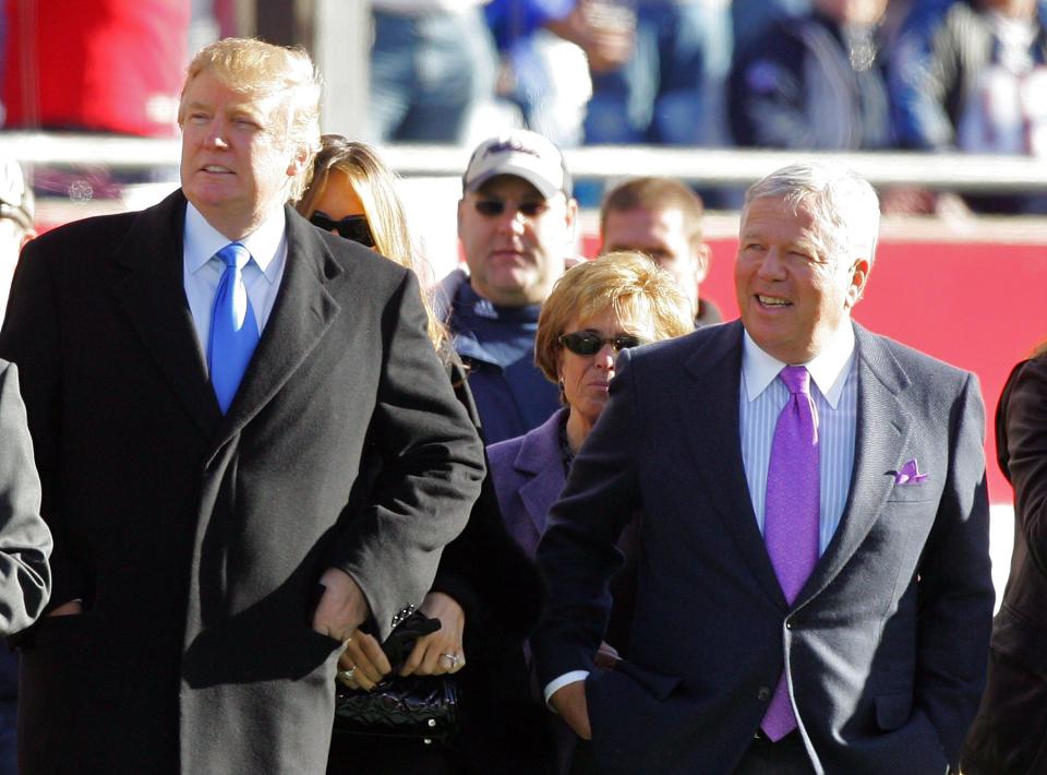  Trump and owner of the New England Patriots Robert Kraft stand on the sidelines