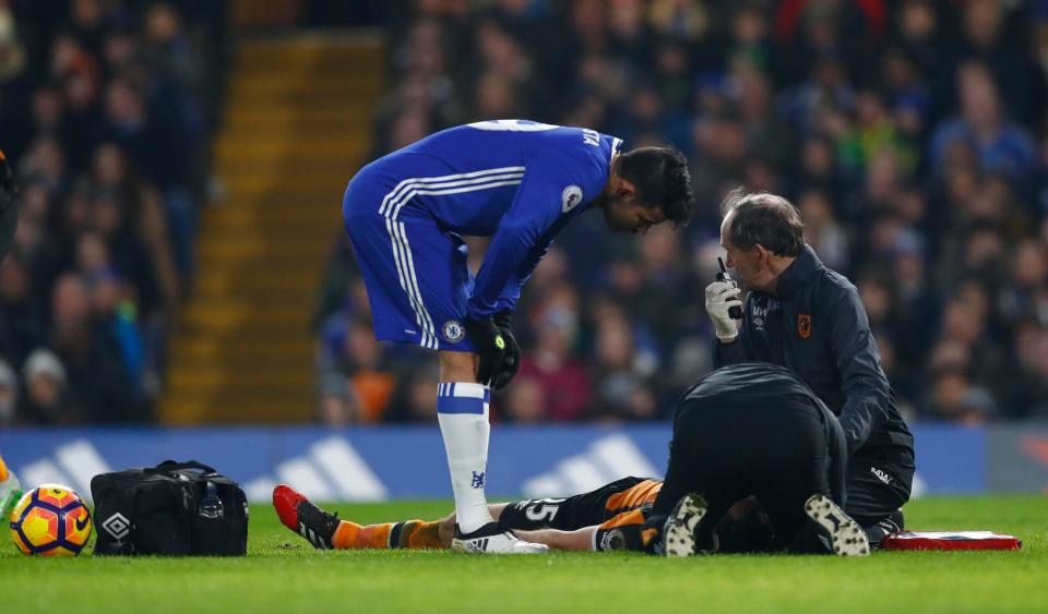  Diego Costa checked on the health of Ryan Mason as the Hull midfielder laid flat out on the pitch