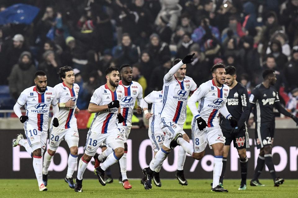  Lyon players celebrate after Lyon's French forward Mathieu Valbuena scored a goal