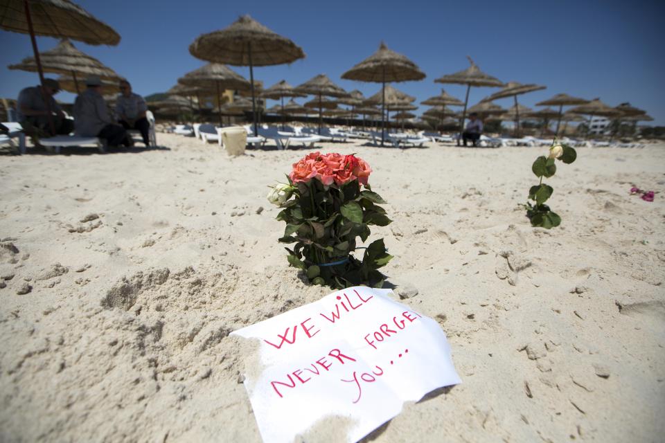  Flowers are laid at the beachside of the Imperial Marhaba resort, which was attacked by a gunman in Sousse, Tunisia, June 28, 2015