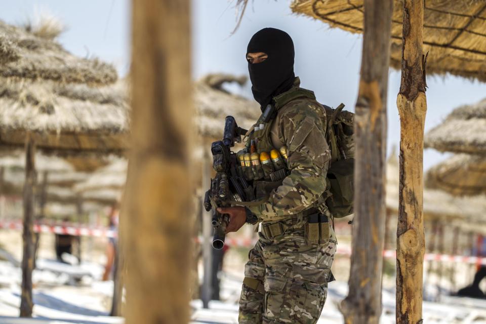  A member of Tunisia's special forces inspects the beachside of the Imperial Marhaba resort