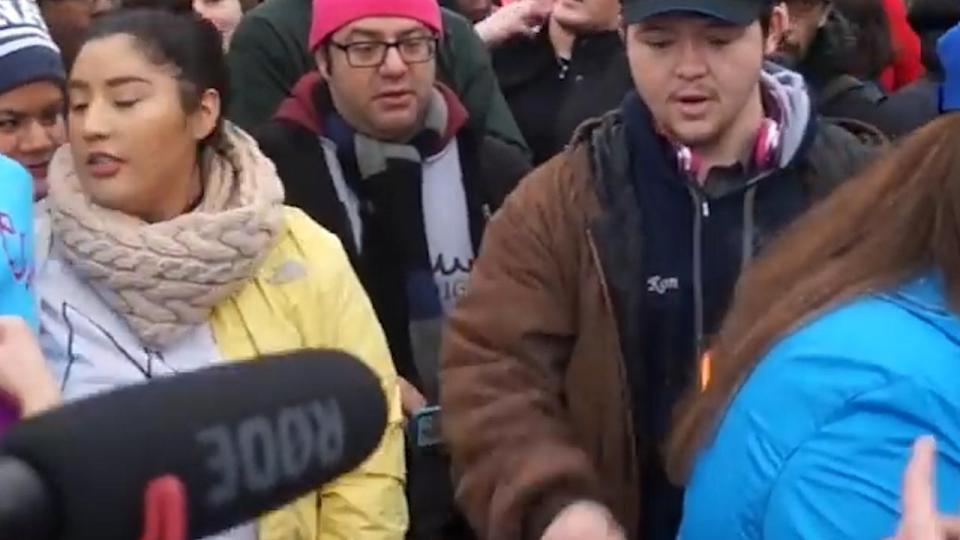  A young Trump fan notices the flames while the girl's remains obvious to the sneak attack