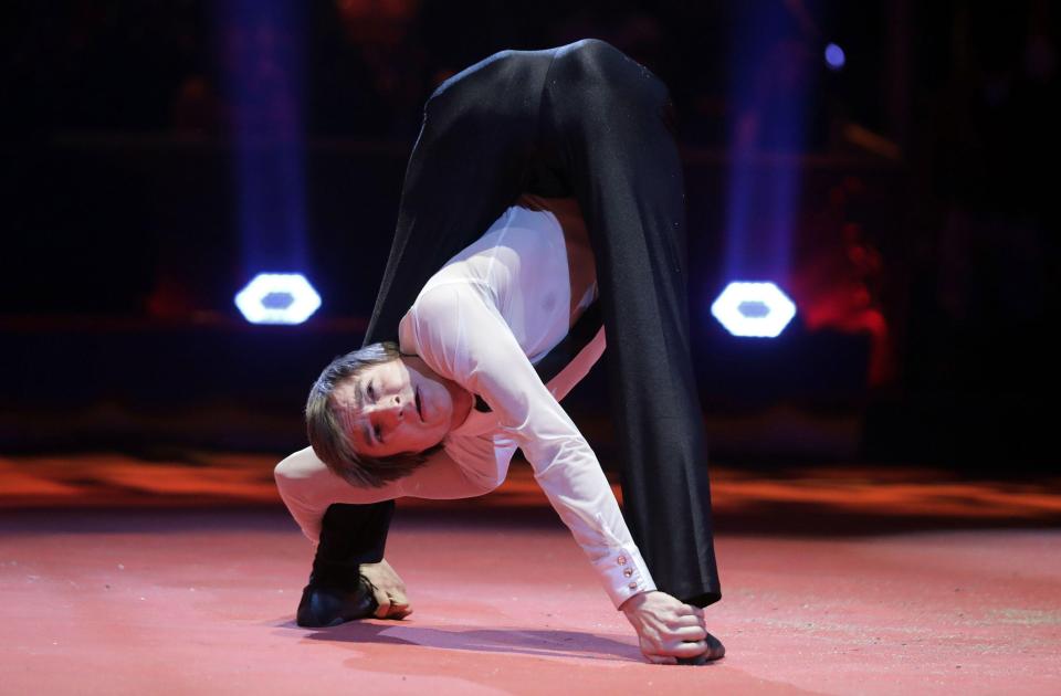  Alexandre Batuev performs a rather impossible looking contortion