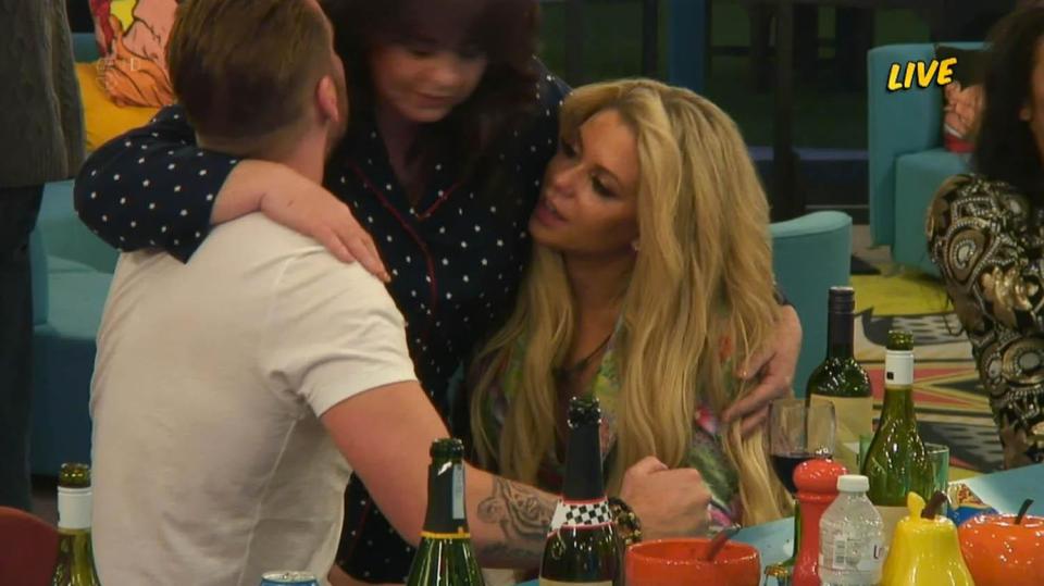  The pair smiled as Coleen gave them a hug