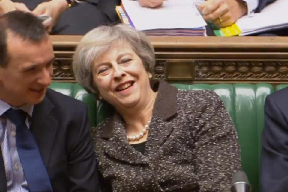  Theresa May laughs at jokes made during PMQs today