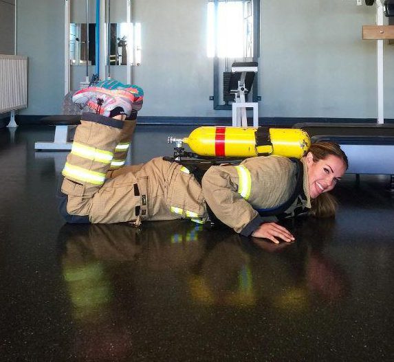  Shes pictured here during the mandatory yearly firefighter test in Norway - dressed up in bunker gear and a tank filled with sand (total weight 23 kg/50,7 lbs) before performing 4 exercises