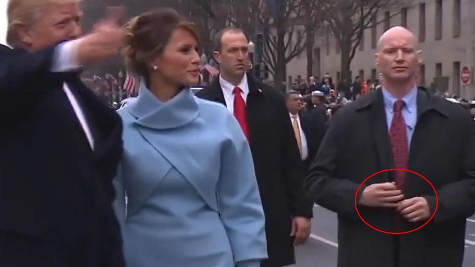  But footage has emerged showing his thumb and fingers moving as he walks behind Trump and Melania