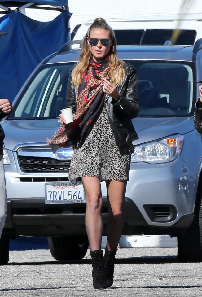  Heidi opted for a casual chic look as she teamed a cheetah print slip dress with sheer black tights