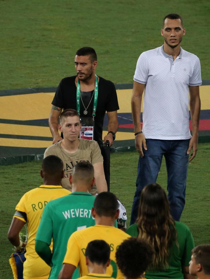  Goalkeeper Jackson Follmann (C), Alan Ruschel (in black) and Helio Neto (right) all survived the crash and were at the game in Rio de Janeiro