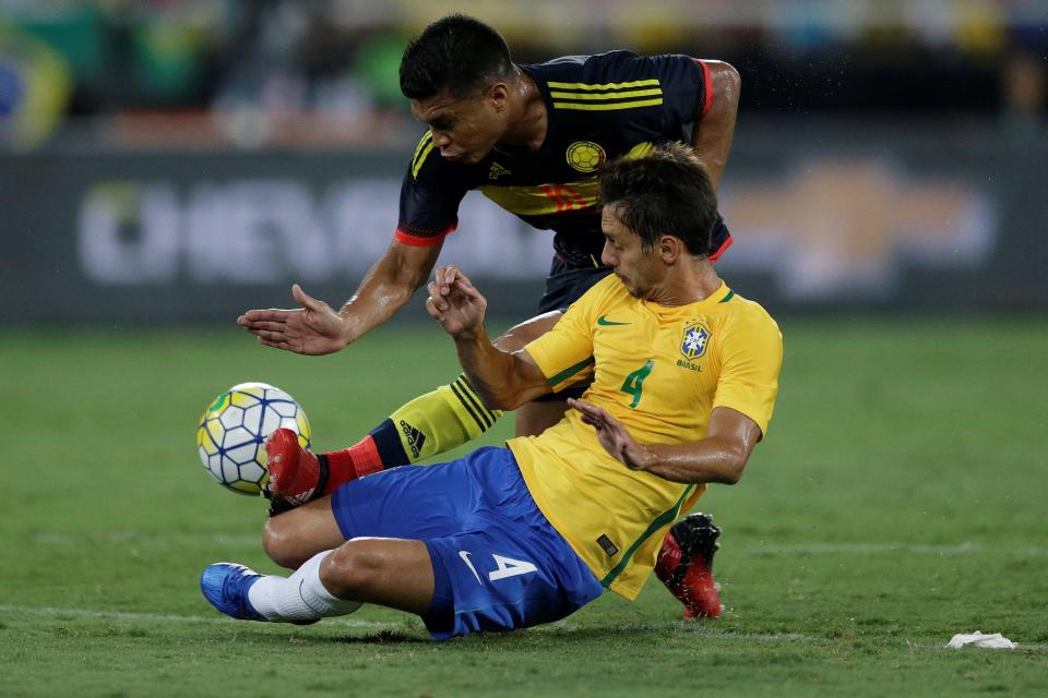  Brazil's Rodrigo Caio and Teofilo Gutierrez proved there was still a competitive spirit to the game