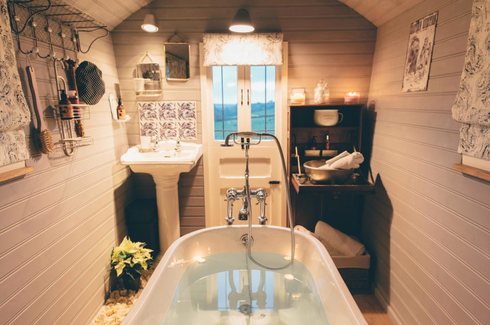  A roll top bath sits in another of the gypsy wagons which took four years to create