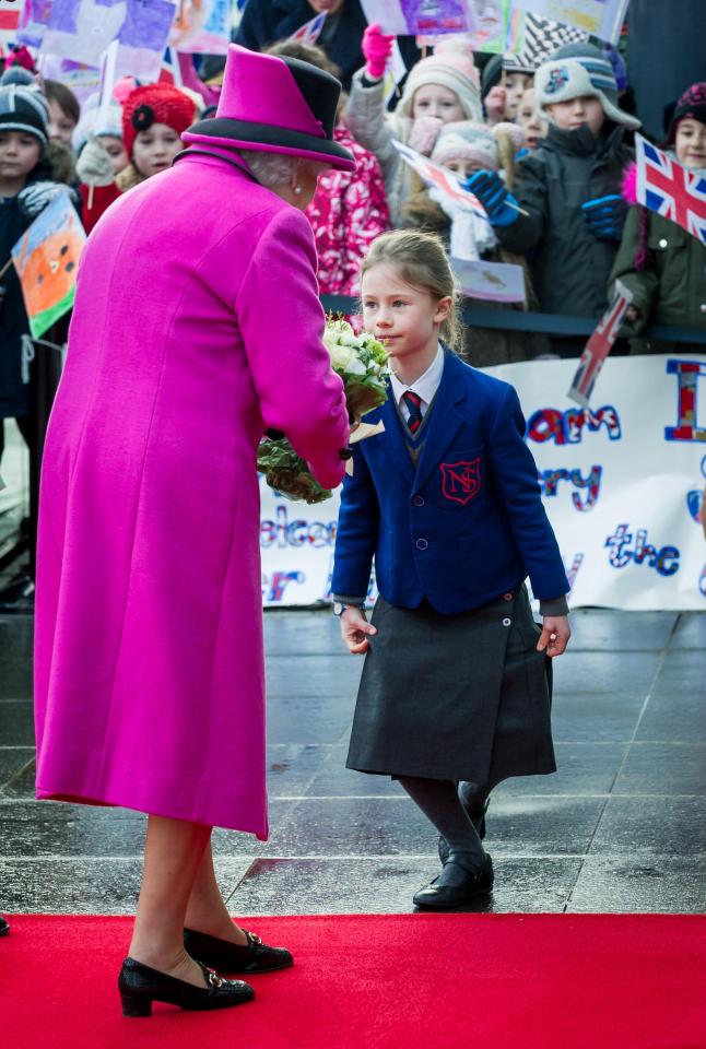  The young girl carries out a perfectly executed curtsy as she greets the Queen