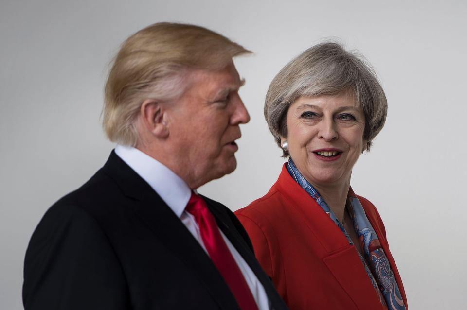  Theresa May came under fire after refusing to condemn Donald Trump's controversial new ban on Muslims entering the US