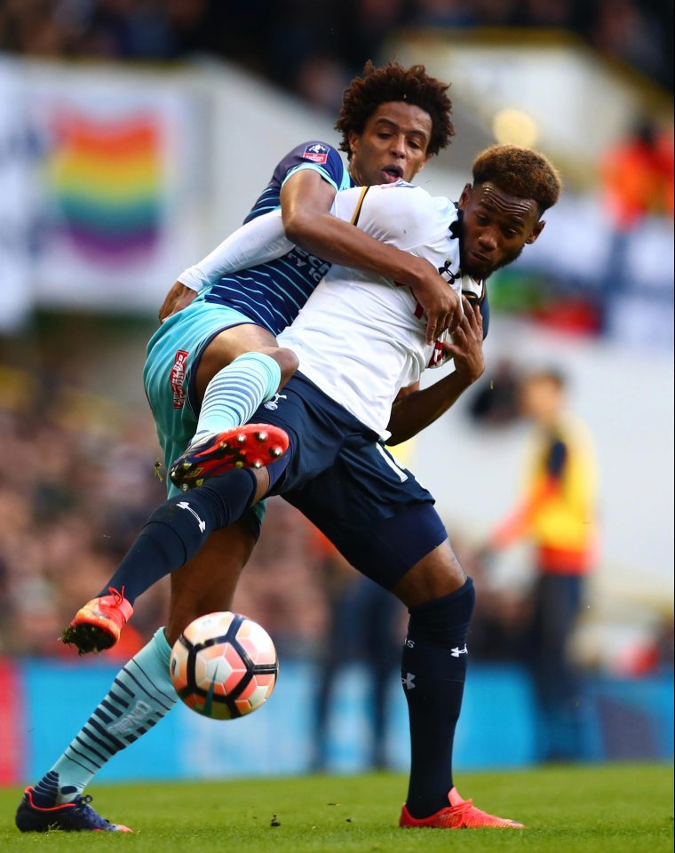  Sido Jombati of Wycombe Wanderers and Georges-Kevin Nkoudou of Tottenham Hotspur in action during the Emirates FA Cup Fourth Round