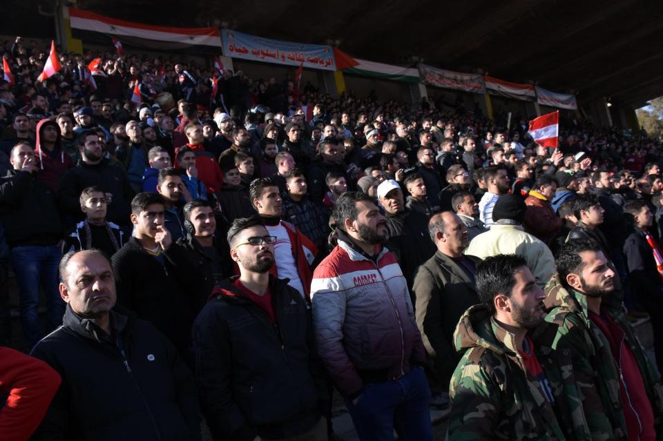  Al-Ittihad fans cheer on their team as they played at home for the first time in years