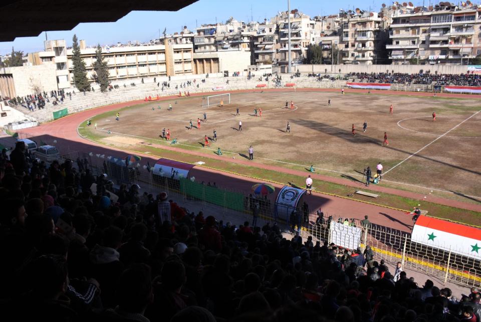  Fans watch the game between the Syrian league rivals on Saturday