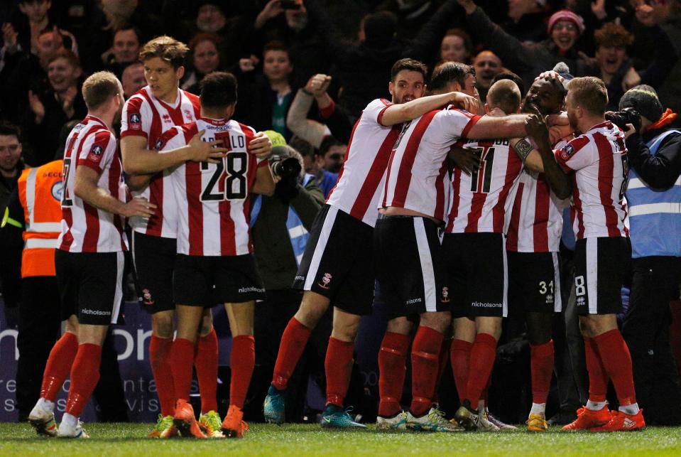  The team celebrate after Theo Robinson nets their third