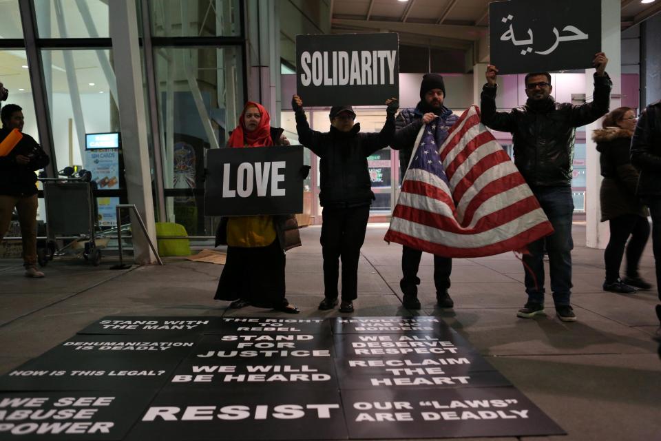  Campaigners outside JFK airport in Queens, New York