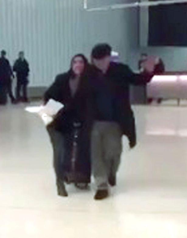  The pair were seen walking through the airport after the family staged a protest over the detention