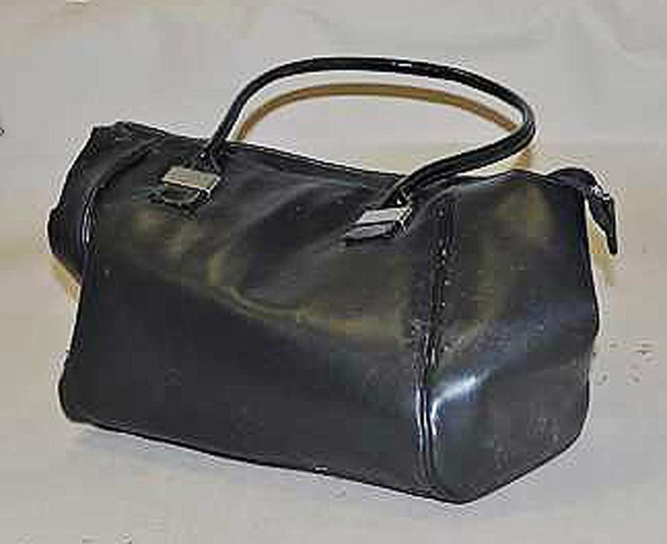  Police are reissuing an appeal for information after a baby boy was found wrapped in a towel and dumped in this handbag