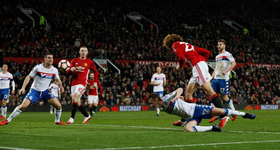  Fellaini heads United into the lead during the first half at Old Trafford