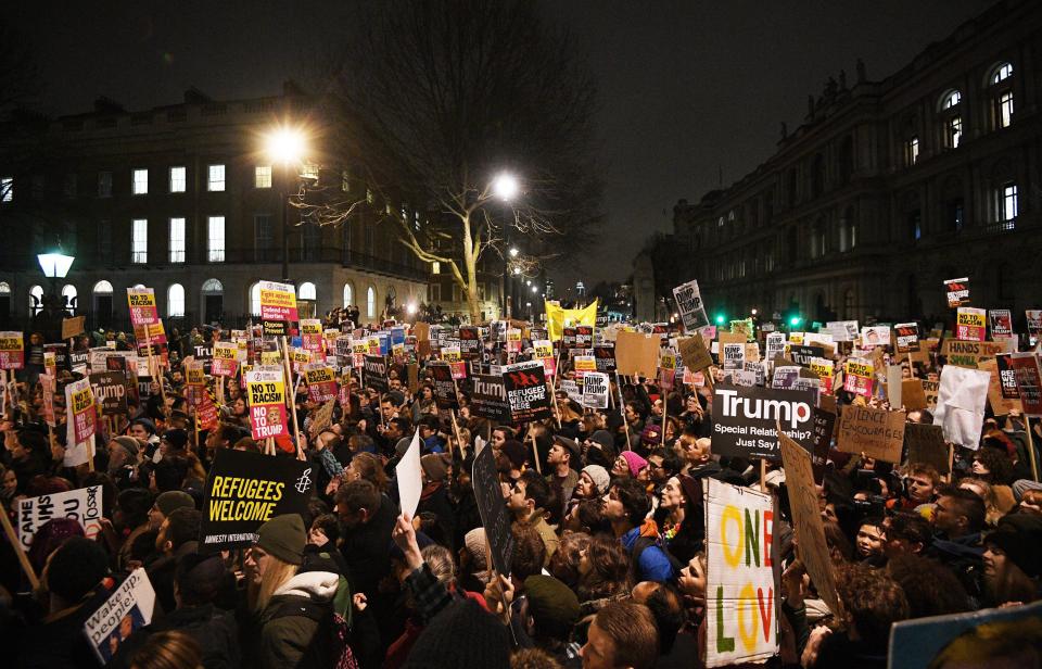  Anti-Trump placards at a massive protest near Downing Street in London on Monday night